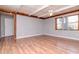 Inviting living room featuring hardwood floors, natural light, and neutral wall color at 211 W Valencia St, Lakeland, FL 33805