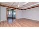 Inviting living room featuring hardwood floors and sliding glass doors at 211 W Valencia St, Lakeland, FL 33805