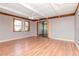 Bright living room with hardwood floors, exposed beam ceiling and sliding glass doors at 211 W Valencia St, Lakeland, FL 33805