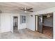Enclosed sunroom with windows, a ceiling fan, and sliding glass doors at 211 W Valencia St, Lakeland, FL 33805