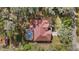 Bird's-eye view displaying a home surrounded by dense trees, emphasizing its natural surroundings at 7641 Sw 185Th Cir, Dunnellon, FL 34432