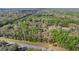 Aerial view of a home nestled within a lush, green forest canopy at 7641 Sw 185Th Cir, Dunnellon, FL 34432
