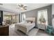 Bedroom featuring a bed, ceiling fan, and access to the screened patio at 7641 Sw 185Th Cir, Dunnellon, FL 34432