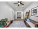 Hallway looking into bedroom with plank flooring, ladder bookshelf, and bench at 7641 Sw 185Th Cir, Dunnellon, FL 34432
