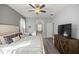 Bedroom featuring a decorative bed, wood look floors, and television at 7641 Sw 185Th Cir, Dunnellon, FL 34432