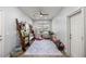 Bright bedroom with a wooden ladder bookshelf and a variety of seating options at 7641 Sw 185Th Cir, Dunnellon, FL 34432