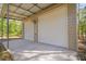 Interior view of the detached two-car garage showing the open floor plan and doors at 7641 Sw 185Th Cir, Dunnellon, FL 34432