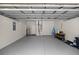 Spacious garage interior with ample storage space and painted concrete floors at 7641 Sw 185Th Cir, Dunnellon, FL 34432