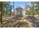 Exterior of detached garage with mature trees around at 7641 Sw 185Th Cir, Dunnellon, FL 34432