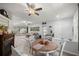 Bright living space with hardwood floors, neutral walls, dining area, and comfortable seating at 7641 Sw 185Th Cir, Dunnellon, FL 34432