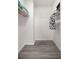 Walk-in closet with wood look floors and wire shelving at 7641 Sw 185Th Cir, Dunnellon, FL 34432