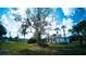 Expansive backyard featuring a well-maintained lawn and mature trees providing plenty of shade at 1401 Josephine St, Lakeland, FL 33815