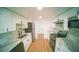 Updated kitchen featuring white cabinets, stainless steel appliances, and sleek countertops at 1401 Josephine St, Lakeland, FL 33815