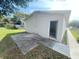 View of garage exterior with concrete pad near a home featuring ample yard space and traditional design at 301 Bassedena N Cir, Lakeland, FL 33805