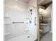 Bright bathroom featuring a walk-in shower with grab bar and handheld shower head at 305 Bearcreek Dr, Bartow, FL 33830