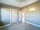 Neutral bedroom with ceiling fan, closet and doorway to another room at 305 Bearcreek Dr, Bartow, FL 33830