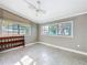 Bedroom with tile floors, neutral walls, and two large windows providing natural light at 305 Bearcreek Dr, Bartow, FL 33830