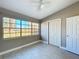 Bedroom with a large window providing ample natural light and closet at 305 Bearcreek Dr, Bartow, FL 33830