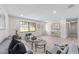 Bright living room featuring modern furniture, gray wood flooring, and contemporary decor at 1005 Hickory Rd, Ocala, FL 34472