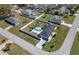 Aerial view of backyard featuring a sparkling pool, privacy fence, and lush landscaping at 17 Se 61St Ct, Ocala, FL 34472