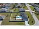 Aerial view showcasing the property's private backyard pool and fenced yard at 17 Se 61St Ct, Ocala, FL 34472