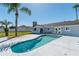 Inviting backyard with an in-ground pool and lush tropical landscaping at 17 Se 61St Ct, Ocala, FL 34472
