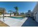 Backyard with an in-ground pool, patio, and lush tropical landscaping at 17 Se 61St Ct, Ocala, FL 34472