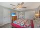 Bedroom featuring ceiling fan, closet, and television over a dresser at 17 Se 61St Ct, Ocala, FL 34472