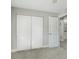 Bedroom features a closet with bi-fold doors and an attached bathroom at 17 Se 61St Ct, Ocala, FL 34472