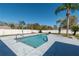 Private backyard pool surrounded by mature landscaping and a secure white fence at 17 Se 61St Ct, Ocala, FL 34472