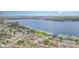 Aerial view of community with lake views, showcasing proximity to the water and other townhomes at 2500 21St Nw St # 88, Winter Haven, FL 33881