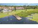 Waterfront living shown in this aerial view of docks, lake, community pool and townhomes at 2500 21St Nw St # 88, Winter Haven, FL 33881