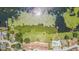 Stunning overhead view showcasing lake access, a community pool, and lush greenery near townhomes at 2500 21St Nw St # 88, Winter Haven, FL 33881