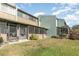 Townhouse backyard with a lush lawn, a privacy wall, and two screened in porches at 2500 21St Nw St # 88, Winter Haven, FL 33881