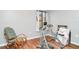 Bright exercise room featuring a rocking chair, exercise machine, and wood floors at 2500 21St Nw St # 88, Winter Haven, FL 33881