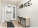 Inviting foyer featuring a decorative door and neutral decor at 2500 21St Nw St # 88, Winter Haven, FL 33881