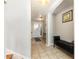 Welcoming foyer with tile floors, console table and neutral walls at 2500 21St Nw St # 88, Winter Haven, FL 33881