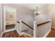 Hallway with staircase and view into bedroom at 2500 21St Nw St # 88, Winter Haven, FL 33881