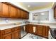 Well-equipped kitchen with stainless steel appliances and ample counter space at 2500 21St Nw St # 88, Winter Haven, FL 33881