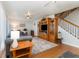 Relaxing living room with staircase, hardwood floors, and ample lighting at 2500 21St Nw St # 88, Winter Haven, FL 33881