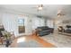 Comfortable living room with plush seating, hardwood floors, and bright lighting at 2500 21St Nw St # 88, Winter Haven, FL 33881