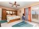 Bright main bedroom featuring balcony access, and tile floors at 2500 21St Nw St # 88, Winter Haven, FL 33881