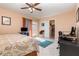 Spacious main bedroom featuring balcony access and tile floors at 2500 21St Nw St # 88, Winter Haven, FL 33881