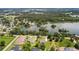Aerial view of a home on a lake showing backyard, roof, and waterfront community at 2569 Rogers Rd, Lakeland, FL 33812