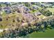 Panoramic aerial view of a home lot near a tranquil lake; this property offers a balance of nature, comfort, and convenience at 2569 Rogers Rd, Lakeland, FL 33812