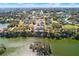 An aerial view of a home lot and a beautiful lake; build your lakeside retreat and enjoy a lifestyle of leisure and luxury at 2569 Rogers Rd, Lakeland, FL 33812
