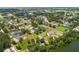 Scenic aerial view of community homes nestled near a serene lake and wooded areas at 2569 Rogers Rd, Lakeland, FL 33812