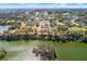 An aerial view showing the community, green landscaping, and stunning lake views at 2569 Rogers Rd, Lakeland, FL 33812