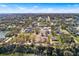 Aerial view of a homesite foundation surrounded by mature trees and a lake at 2569 Rogers Rd, Lakeland, FL 33812