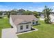Expansive aerial view of a well-maintained single-Gathering home, showcasing its landscaped surroundings at 2569 Rogers Rd, Lakeland, FL 33812